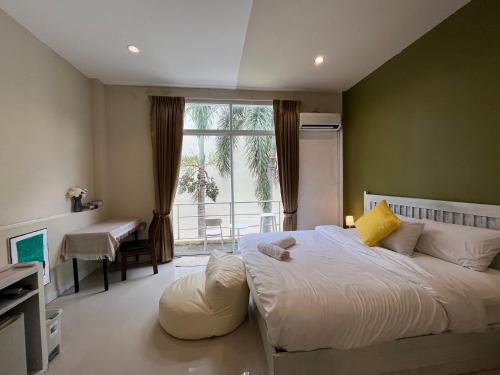 Cama o camas de una habitación en TIL DAWN Phuket