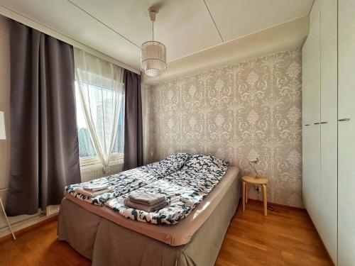 Postel nebo postele na pokoji v ubytování Elegant and Cozy Apartment with Sauna in Espoo