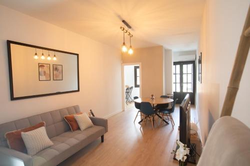 a living room with a couch and a table at Apartamento Coque -Cazorla in Cazorla