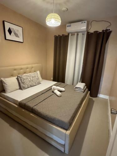 a bedroom with a large bed with at Casa Josa in Antipolo