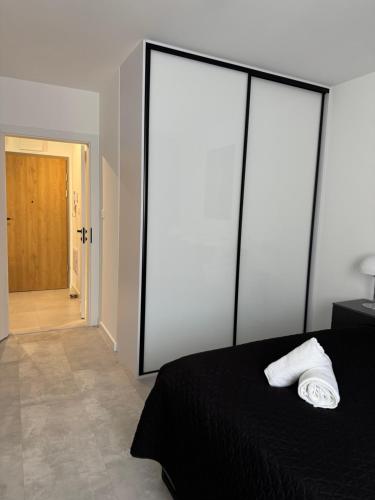 En eller flere senge i et værelse på Apartamenty Cegielnia 1 Lux-Haus