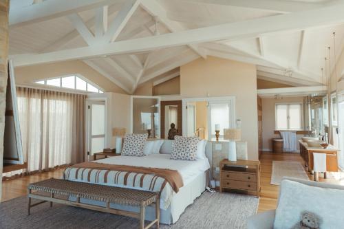 a large bedroom with a large bed in a room at Dune Rose Yzerfontein Villa in Yzerfontein