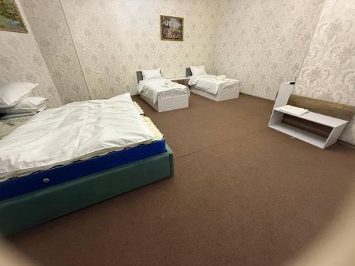 Postel nebo postele na pokoji v ubytování Velvet Hotel