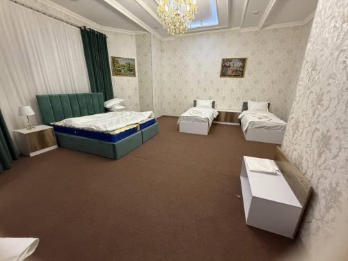 Postel nebo postele na pokoji v ubytování Velvet Hotel