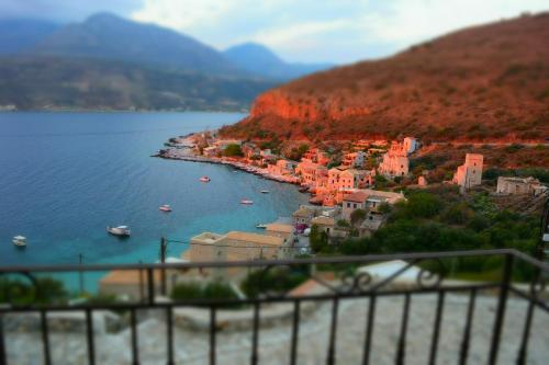 a small town on the shore of a body of water at Vasilios Apartments Hotel in Limeni