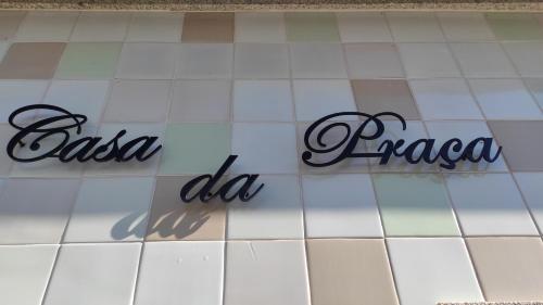 a tile floor with the words oasis la favora on it at Casa da Praça in Murtosa