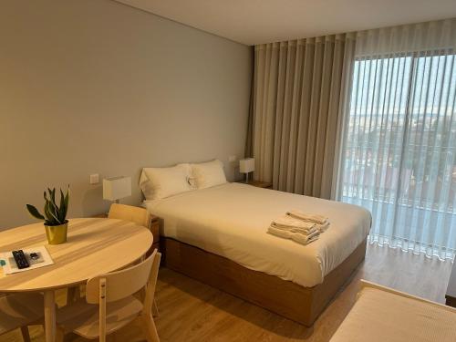 Postel nebo postele na pokoji v ubytování New Douro Tower 203