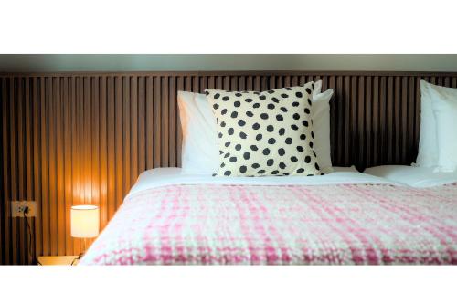 Postel nebo postele na pokoji v ubytování Quies Hotel