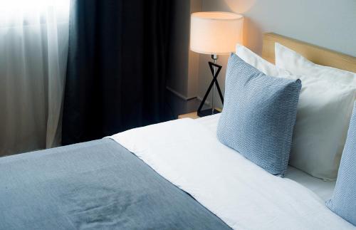 Postel nebo postele na pokoji v ubytování Quies Hotel