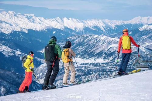 a group of people standing on top of a mountain at Shgedi Mestia in Mestia