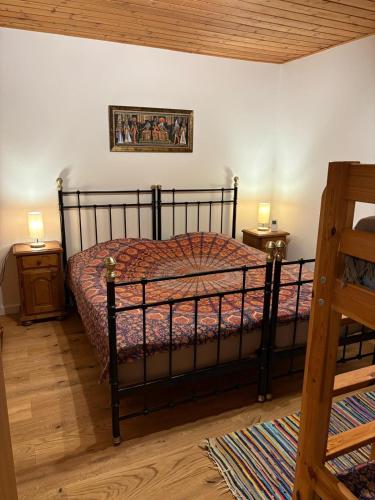 a bedroom with a bed and two night stands at Holiday home Gröbming Ski Mountains in Gröbming