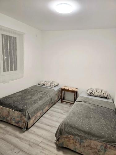 Postel nebo postele na pokoji v ubytování Apartman Keka