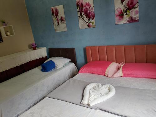 Postel nebo postele na pokoji v ubytování Pousada Flores