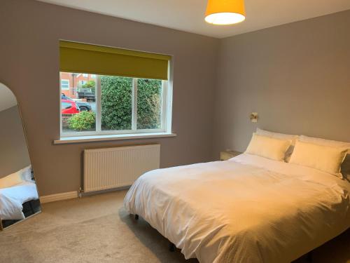 En eller flere senge i et værelse på Seaside Serenity