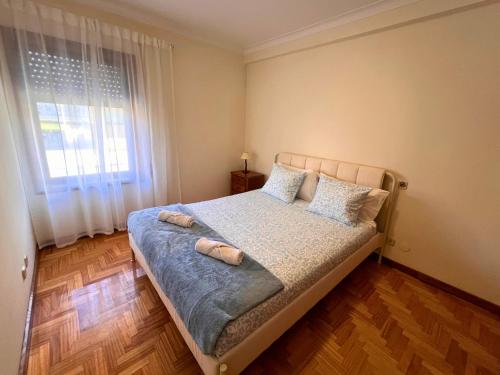 En eller flere senge i et værelse på Lourença Stays - Vila Beach Apartment 2