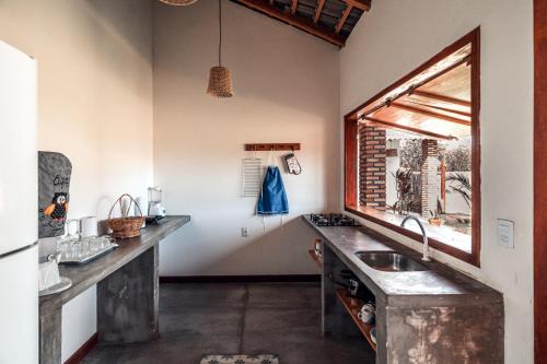 Kuchyň nebo kuchyňský kout v ubytování Villa Chalés - andar superior