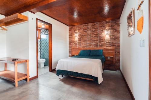 Postel nebo postele na pokoji v ubytování Villa Chalés - andar superior