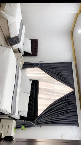 Llit o llits en una habitació de Hojin Hotel