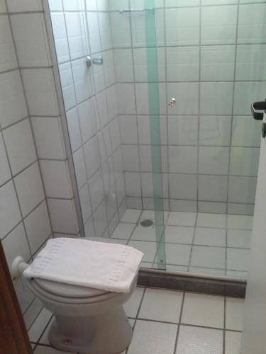 a bathroom with a shower with a toilet at Apart Quartier Latin Hotel in Vitória