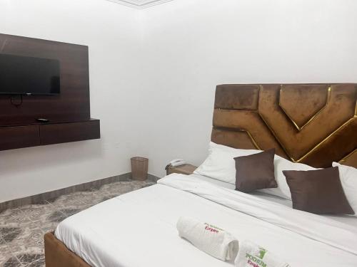 Ένα ή περισσότερα κρεβάτια σε δωμάτιο στο Podium Empire