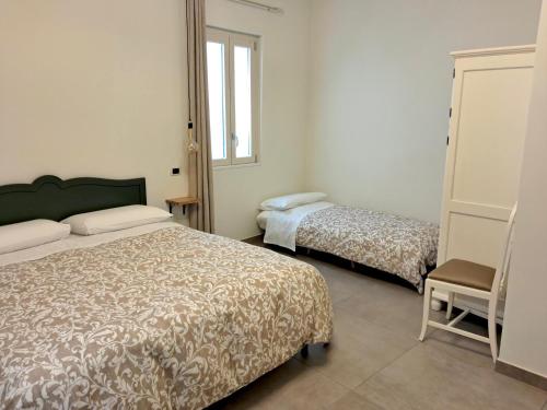Postel nebo postele na pokoji v ubytování B&B Arco Trinità