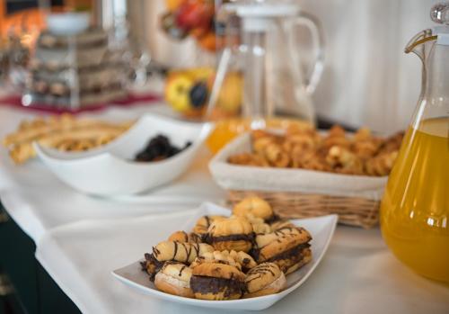 a table with a plate of food on a counter at Magus Hotel in Baia Mare