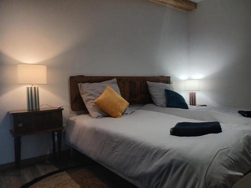 Giường trong phòng chung tại Les Terrasses du Verger