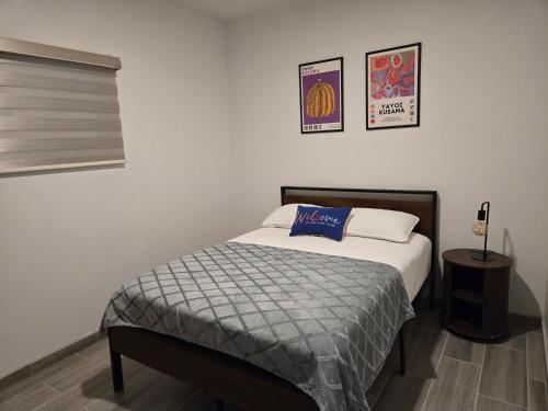 Ένα ή περισσότερα κρεβάτια σε δωμάτιο στο Departamento premium en el corazón de la ciudad