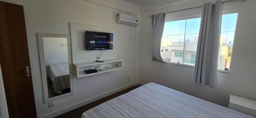 En eller flere senge i et værelse på Apartamento Vista Mar