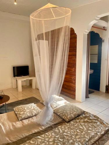 En eller flere senge i et værelse på Cocon Douillet à 10 min du Marin