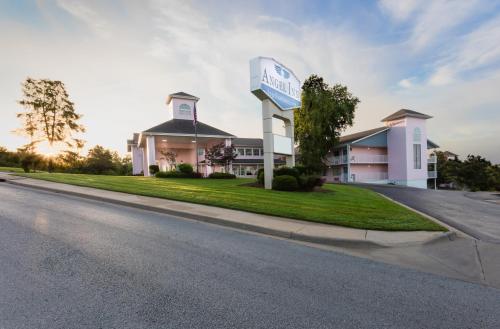 a building with a sign on the side of a road at Angel Inn - Central in Branson