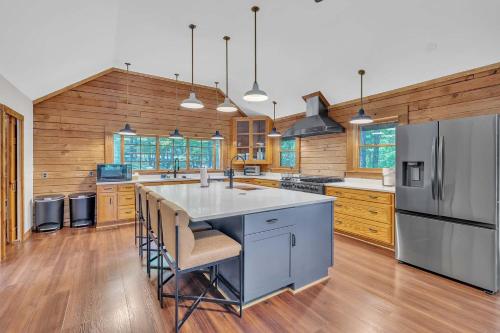 a large kitchen with a large island in the middle at Gorgeous Lakefront Escape - New Renovations in Mineral