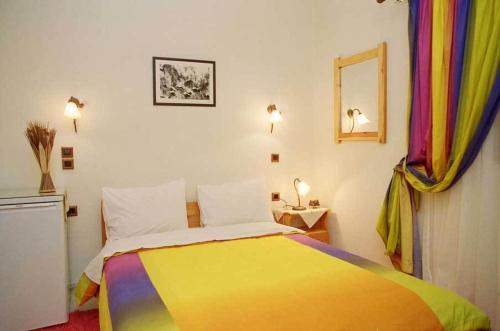 Postel nebo postele na pokoji v ubytování Guesthouse Irida