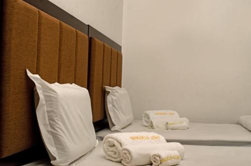 Giường trong phòng chung tại Manguela Light