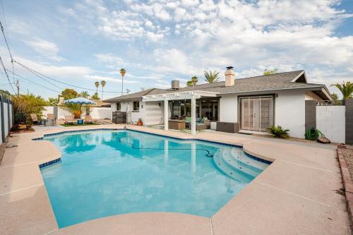 a swimming pool in front of a house at Pool paradise near ASU campus & Scottsdale in Tempe