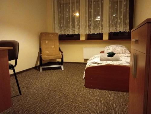 Een bed of bedden in een kamer bij Hotel Sowa