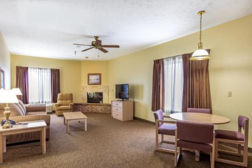 a living room with a couch and a table at Branson Towers Hotel in Branson
