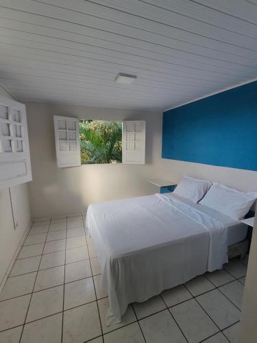 En eller flere senge i et værelse på Casa para Carnaval