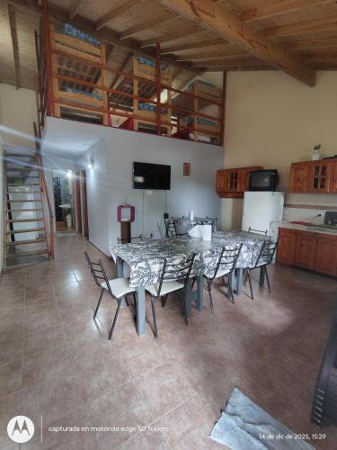 a large dining room with a table and chairs at Large Duplex #1 in San Bernardo