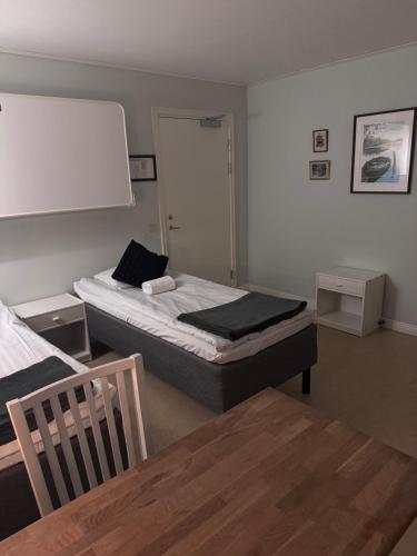 En eller flere senge i et værelse på Kapellskärs Camping och Vandrarhem