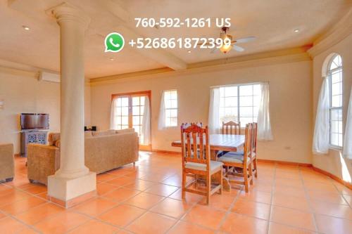 a living room with a table and chairs and a couch at Casa La Vida Dulce in El Dorado Ranch San Felipe. 18-Hole Golf Course in San Felipe