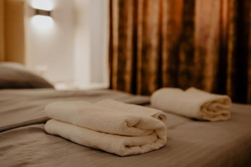 Giường trong phòng chung tại Suite Dolce Vita BnB & Spa