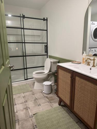 a bathroom with a toilet and a sink at Modern Nature Escape in Sparta