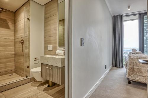 a bathroom with a toilet sink and a shower at Bella Vista at Ellipse in Midrand
