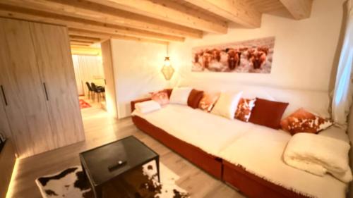 Giường trong phòng chung tại Maso K La Mucca Rossa