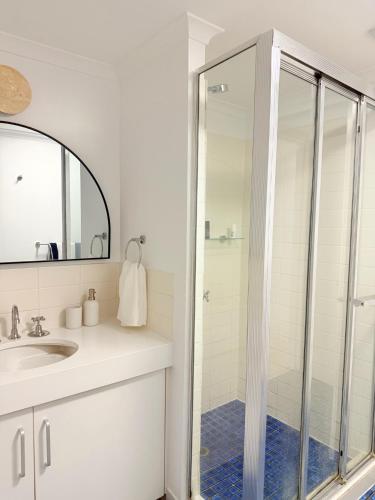 a bathroom with a shower and a sink at 2Bdr Beachfront Apartment - First Bay Coolum in Coolum Beach