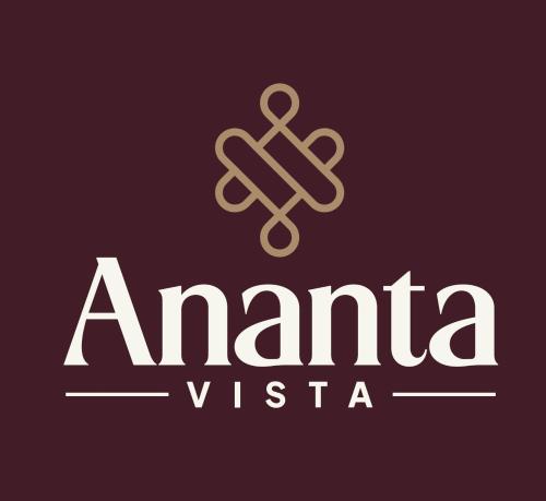 a logo for anemia vista with a gold cross at Hotel Ananta Vista in Jāwad