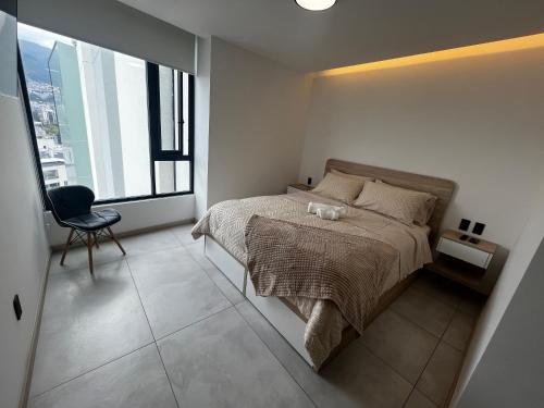 Postel nebo postele na pokoji v ubytování Suite ejecutiva - Trabajo y Descanso - Exclusividad y Lujo - Sector La Carolina, Quito