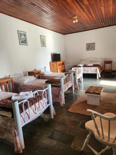 En eller flere senge i et værelse på Pousada Pedacinho do Céu -Chalé Familia