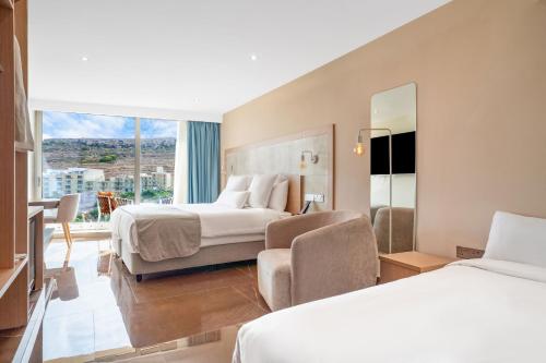 Postel nebo postele na pokoji v ubytování Reef Hotel & Spa